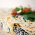 Green onion Parmesan crepes with ricotta, spinach, bacon and mushroom filling