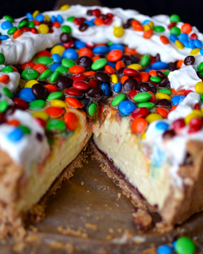 M&M Cheesecake with Chocolate Covered Pretzel Crust