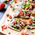 Strawberry, pear and pesto flatbread with balsamic reduction drizzle