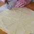 Slit the base of each triangle