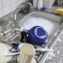 Heaps of dishes drying on the counter