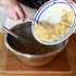 Add the mashed banana to the buttery sugar mixture and whisk
