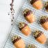 Chocolate dipped pistachio madeleines