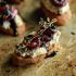 Crostini with roasted cherries and thyme on almond ricotta with honey and balsamic