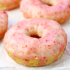 Vanilla cakes donuts with strawberry glaze