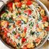Shrimp, Tomato And Spinach Pasta In Garlic Butter Sauce