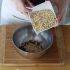 In a bowl, combine the almonds and rolled oats