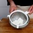 Remove the excess powder
