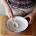 Transfer the cream cheese mixture to an 8 oven-safe bowl, and smooth over the top with a spoon