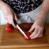 Cut off the bottom tip of the strawberries