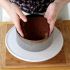 Place your first cake layer into the bottom of the circle
