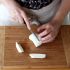 Slice the mozzarella balls into large matchsticks and let drain on a plate for 15 minutes