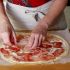 Cover the cream cheese with the prosciutto cut into pieces