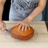 Cut the cake in half