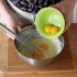 Add the egg yolks, and mix