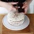 Cover with roughly grated dark chocolate, using a peeler and refrigerate