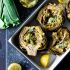 ROASTED artichokes with lemony leek dressing