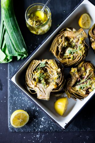 ROASTED artichokes with lemony leek dressing