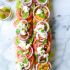 Heirloom Tomato Avocado and Burrata Salad on Grilled Garlic Toast