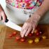 Cut the cherry tomatoes in half