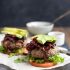 Paleo burgers with avocado and caramelized onions
