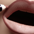 Putting a dark contour on your lips