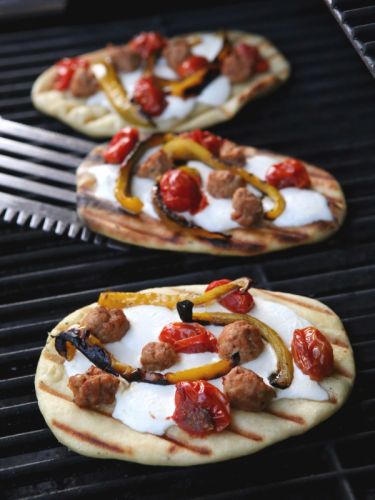Grilled Pizzas with Sausage, Peppers, Roasted Tomatoes and Mozzarella