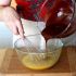 Pour the melted chocolate onto the egg-sugar mixture