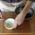 Gently beat the egg white with a fork, then add it to the bowl