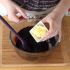 When the mixture is at 100 °F, add the softened butter cut into cubes