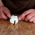 Place the rice ball onto the salmon