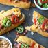 Bacon Wraped Cheese Stuffed Hot Dogs With Crispy Onions and Jalapenos
