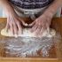 Shape the ball into a long roll on a floured surface