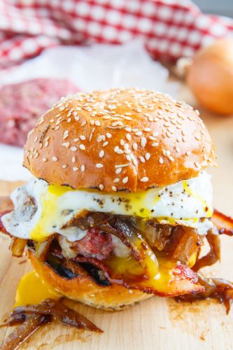 Bacon and Cheese Corned Beef Burger with Guinness Caramelized Onions and a Fried Egg