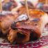 Prunes enrobed in bacon with plum dipping sauce
