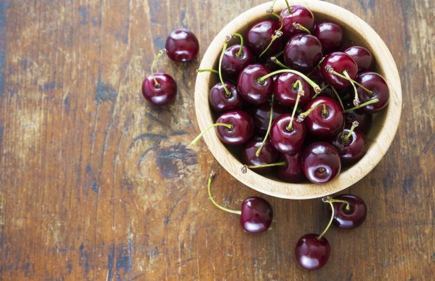 Pit Cherries With A Beer Bottle