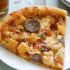 Bratwurst and potato pizza with beer crust
