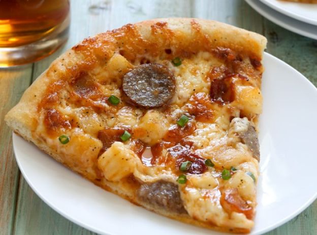 Bratwurst and potato pizza with beer crust