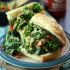 Hot garlicky broccoli rabe sandwich with smoky tahini cheese sauce