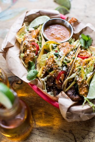 Bulgogi BBQ Pork Tacos with Charred Tomatillo Sesame Sauce and Spring Onion Slaw