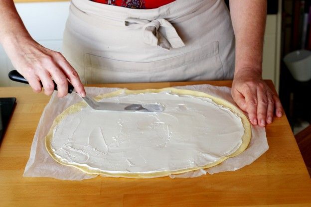 Spread the cream cheese over the whole sheet of puff pastry