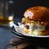 BACON AND BRIE BURGER WITH SPICY PEACH CARAMELIZED ONIONS