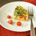 Quinoa breakfast casserole with tomato and spinach
