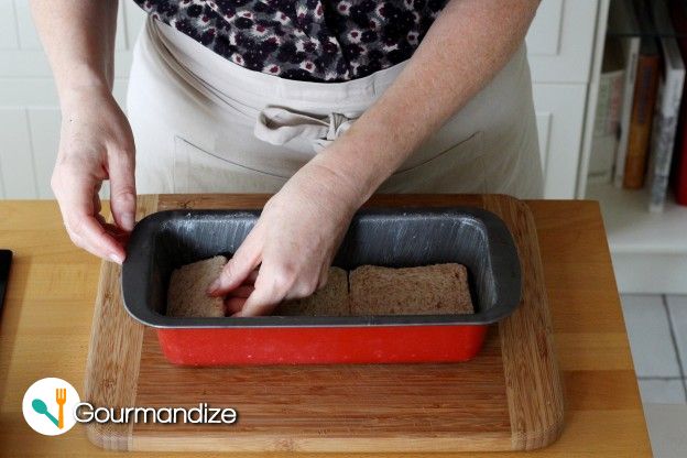 Add 2 1/2 slices of bread into the bottom of the loaf pan