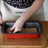Add 2 1/2 slices of bread into the bottom of the loaf pan