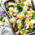sheet pan roasted spring vegetables with baked eggs
