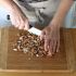 Roughly chop the almonds