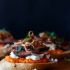 Filet Mignon Crostini with Romesco, Goats Cheese, and Crispy Shallot