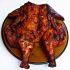 Grilled butterflied whole chicken with barbecue sauce