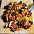 Grilled chicken with tomato, soy and sesame seeds